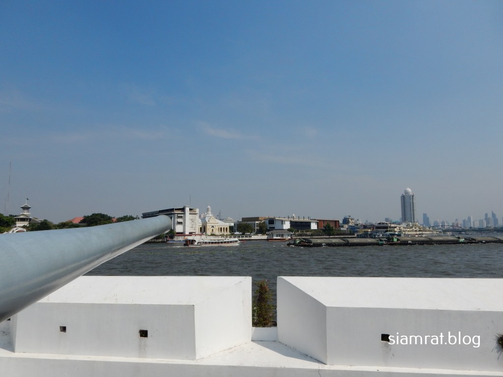 gun pointing out over river